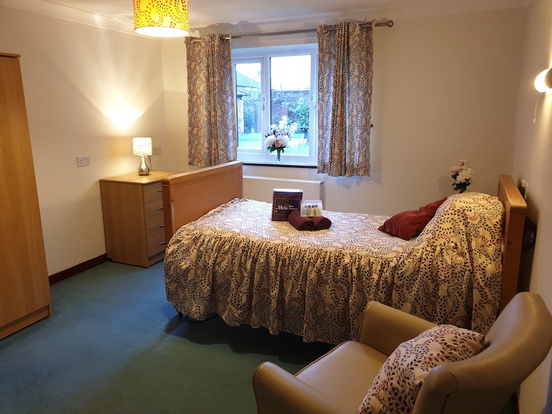 Bedroom at Moss View with chocolates on bed